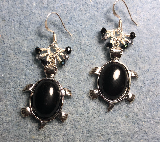 Large silver and black onyx gemstone turtle charm earrings adorned with small dangling black and silver Czech glass beads.