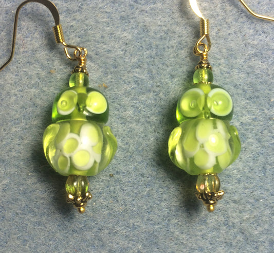 Lime green lamp work owl bead earrings adorned with lime green Czech glass beads.