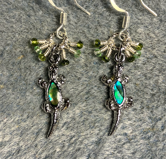 Small silver and abalone lizard charm earrings adorned with tiny dangling green Chinese crystal beads.