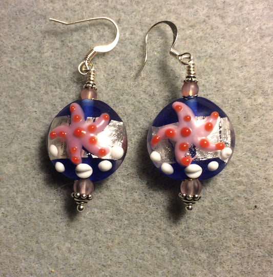 Dark blue, silver, and pink lamp work starfish bead earrings adorned with light pink Czech glass beads.