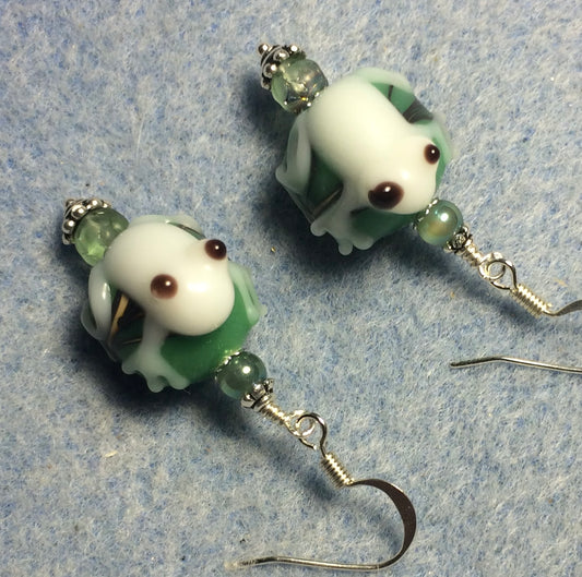 White and green lamp work frog bead earrings adorned with green Czech glass beads.