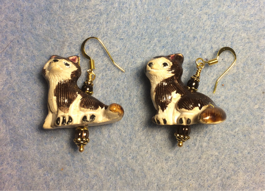 Brown and white ceramic Siberian Husky bead earrings adorned with brown Czech glass beads.