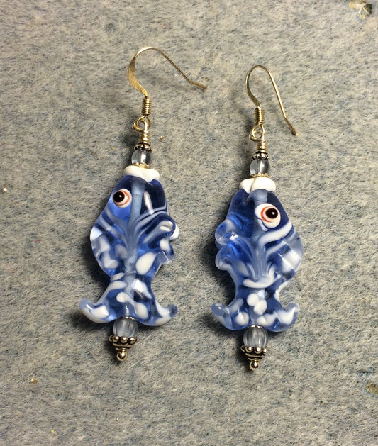 Translucent light blue and white lamp work spotted fish bead earrings adorned with light blue Czech glass beads.