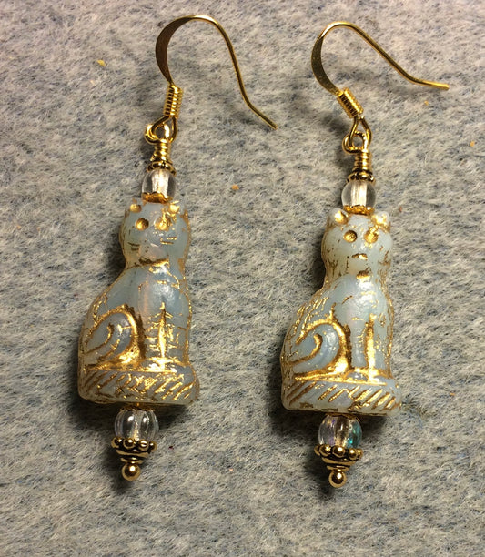 Opaque off white (with gold inlay) fancy Czech glass cat bead earrings adorned with clear Czech glass beads.