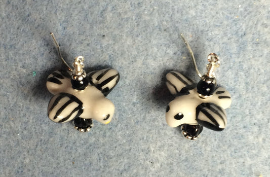 Black and white ceramic striped flying bird bead earrings adorned with black Czech glass beads.