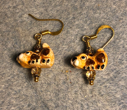 Small brown and tan ceramic hound dog bead earrings adorned with amber Chinese crystal beads.