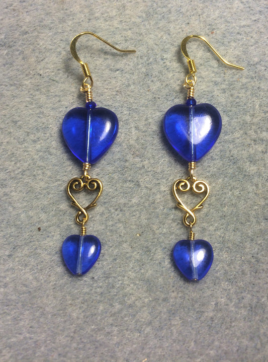 Large and small matching bright blue Czech glass heart bead earrings joined by gold Tierracast heart connectors.