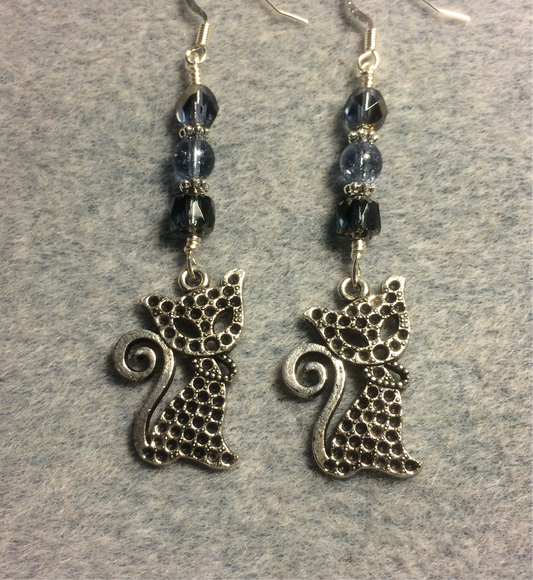 Silver ornate cat charm earrings adorned with Montana blue Czech glass beads