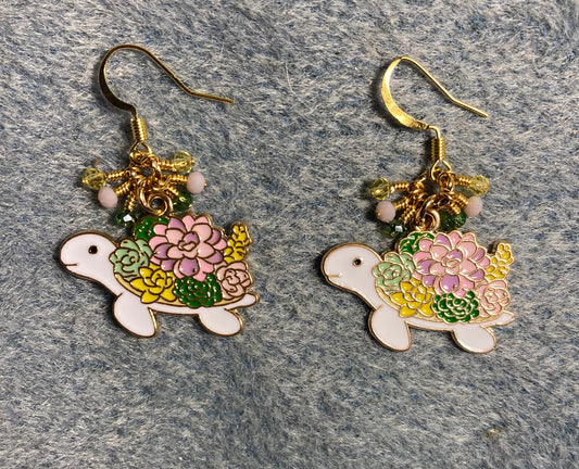 Pink, green, yellow, and white enamel sea turtle charm earrings adorned with tiny dangling pink, green, and yellow Chinese crystal beads.