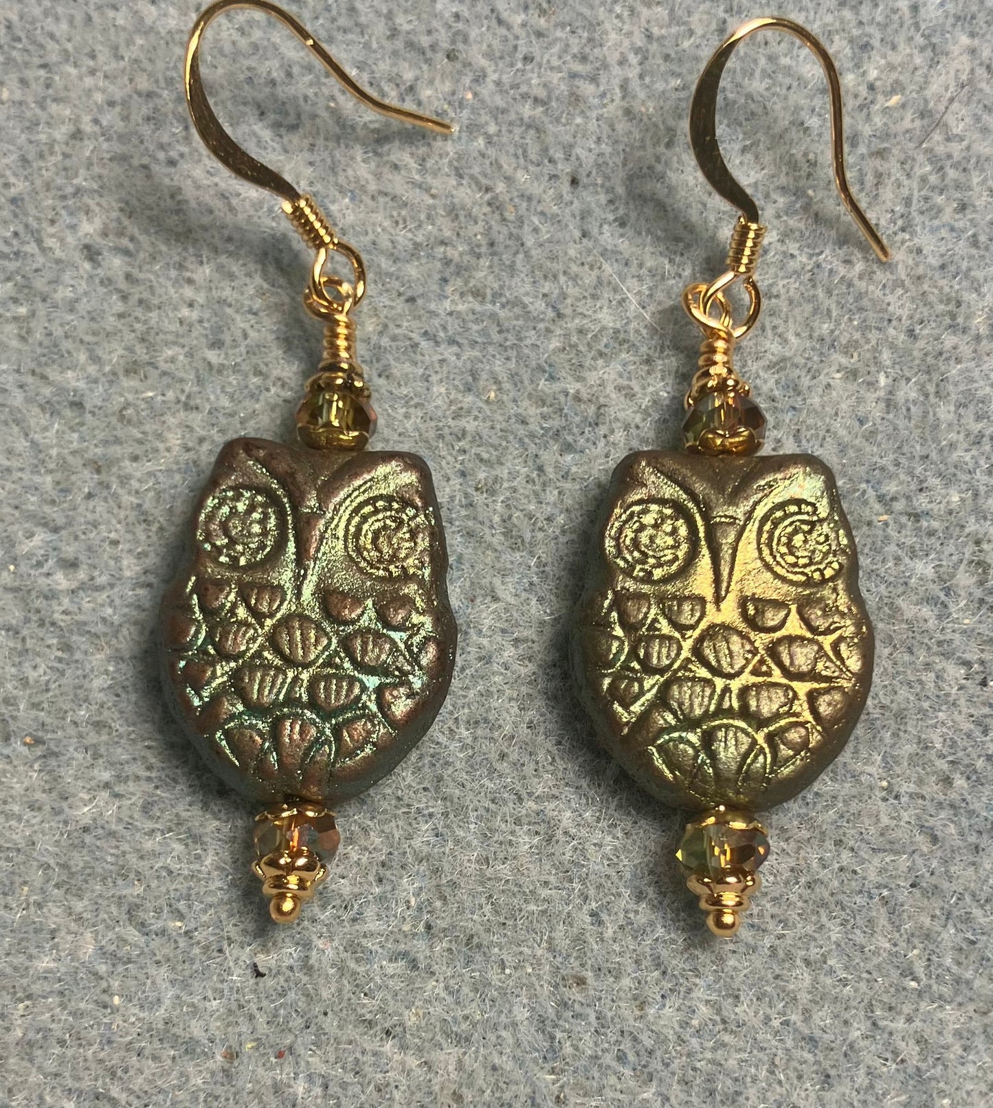 Sparkly green Czech glass owl bead earrings adorned with sparkly green Chinese crystal beads.