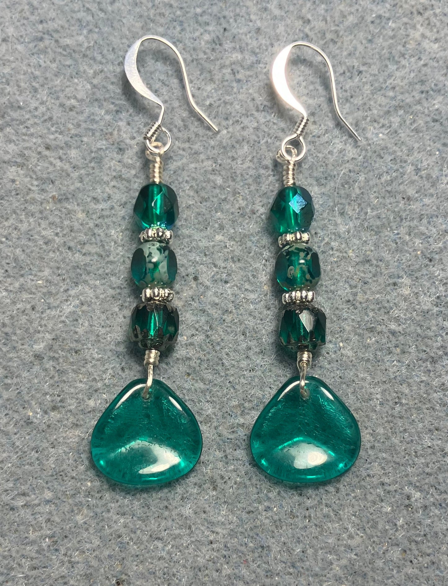 Translucent teal Czech glass rose petal earrings adorned with teal Czech glass beads.