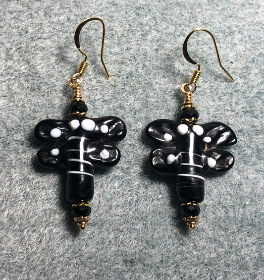 Black and white lamp work dragonfly bead earrings adorned with black Chinese crystal beads.
