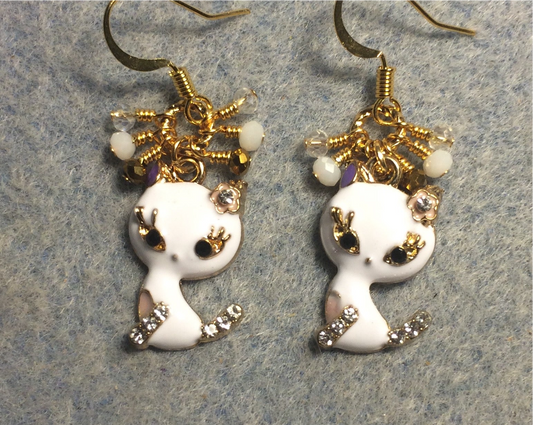 Small white and gold enamel and rhinestone cat charm earrings adorned with tiny dangling white, gold, and clear Chinese crystal beads.