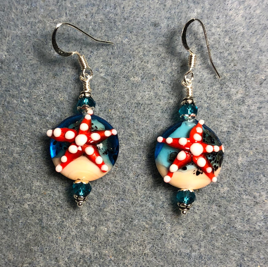 Turquoise, red, and tan lamp work starfish bead earrings adorned with turquoise Chinese crystal beads.