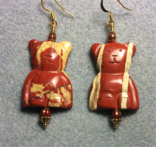 Large red jasper gemstone cat bead earrings adorned with orange Czech glass beads.