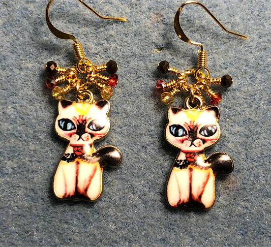 Brown, red, and yellow enamel cat charm earrings adorned with small dangling brown, red, and yellow Chinese crystal beads.