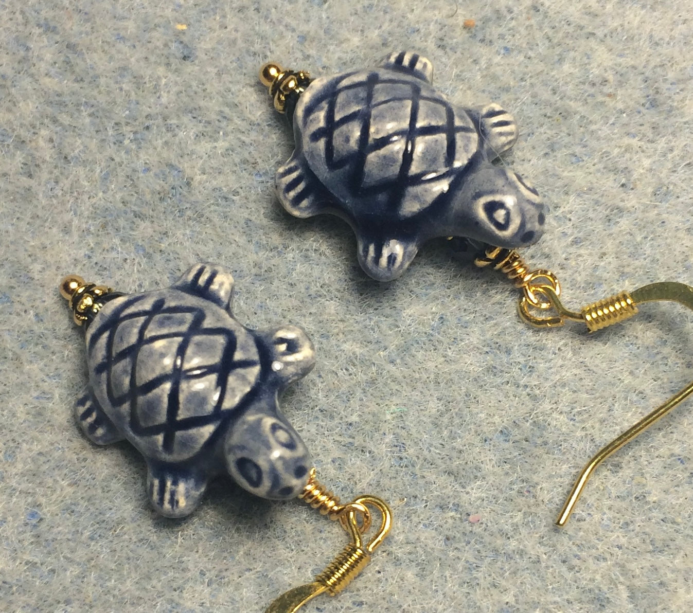 Montana blue ceramic turtle bead earrings adorned with Montana blue Chinese crystal beads.