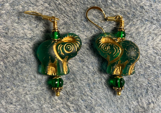 Translucent emerald green (with gold inlay) Czech glass elephant bead earrings adorned with emerald green Czech glass beads.