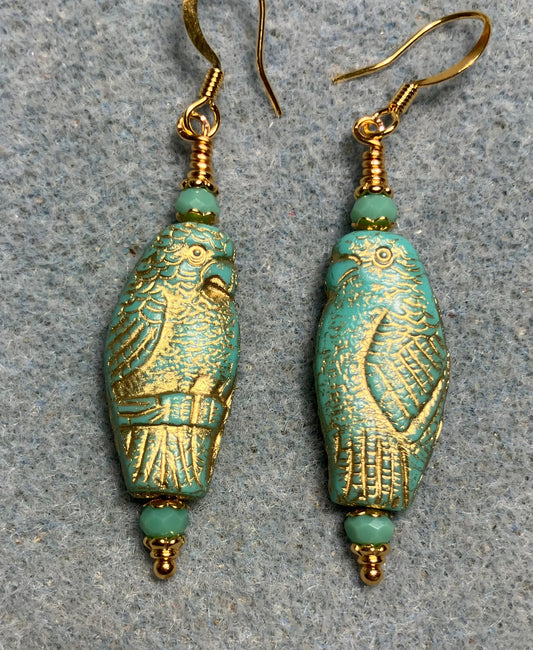 Large turquoise (with gold wash) Czech glass parrot bead earrings adorned with turquoise Chinese crystal beads.