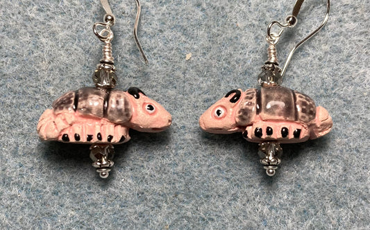 Small tan and gray ceramic armadillo bead earrings adorned with gray Chinese crystal beads.