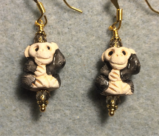 Small black and gray ceramic chimpanzee bead earrings adorned with gray Chinese crystal beads.