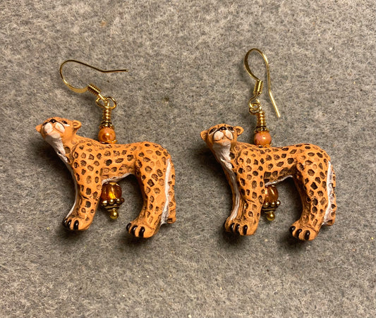 Orange ceramic spotted cheetah bead earrings adorned with orange Czech glass beads.