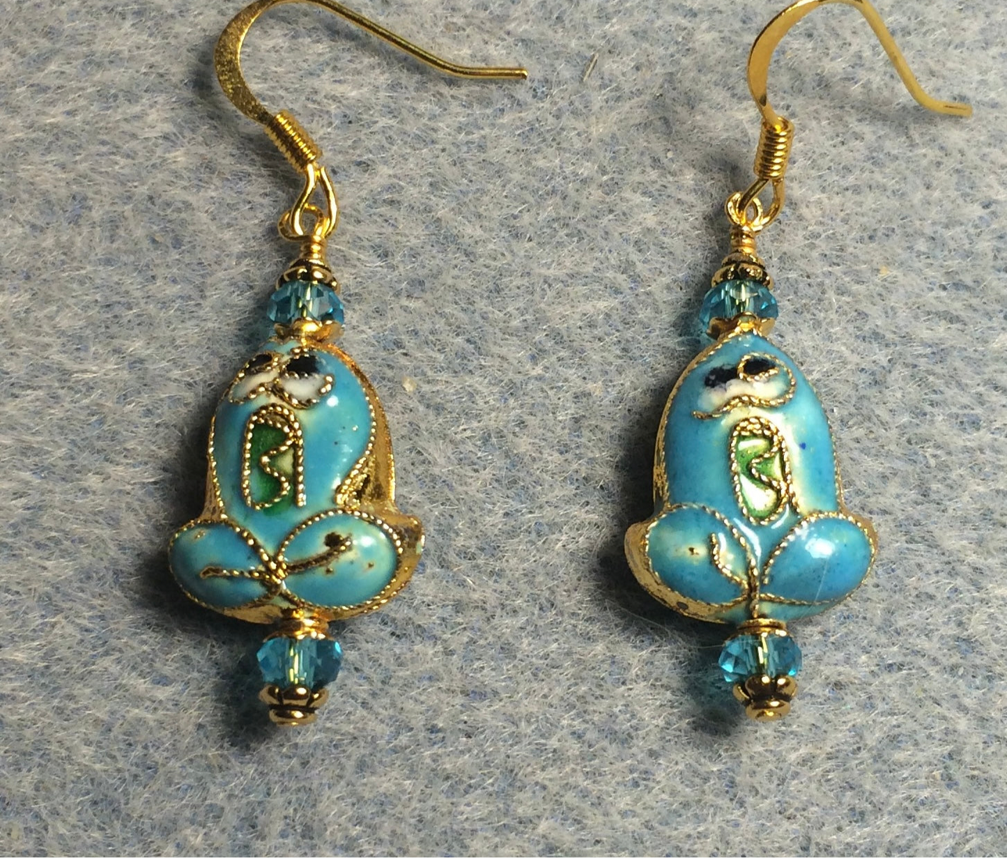 Turquoise cloisonné frog bead earrings adorned with turquoise Chinese crystal beads.