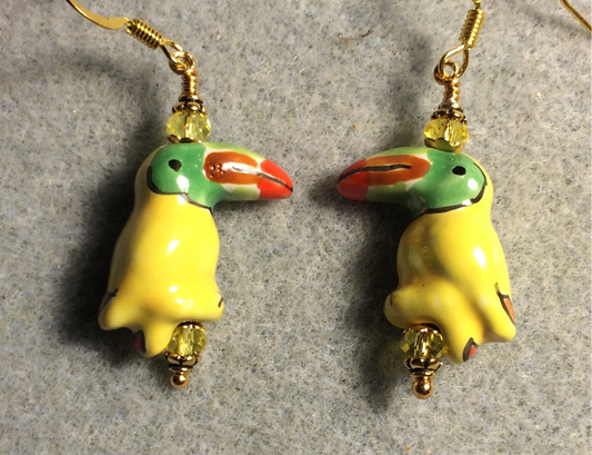 Yellow ceramic toucan bead earrings adorned with yellow Chinese crystal beads.