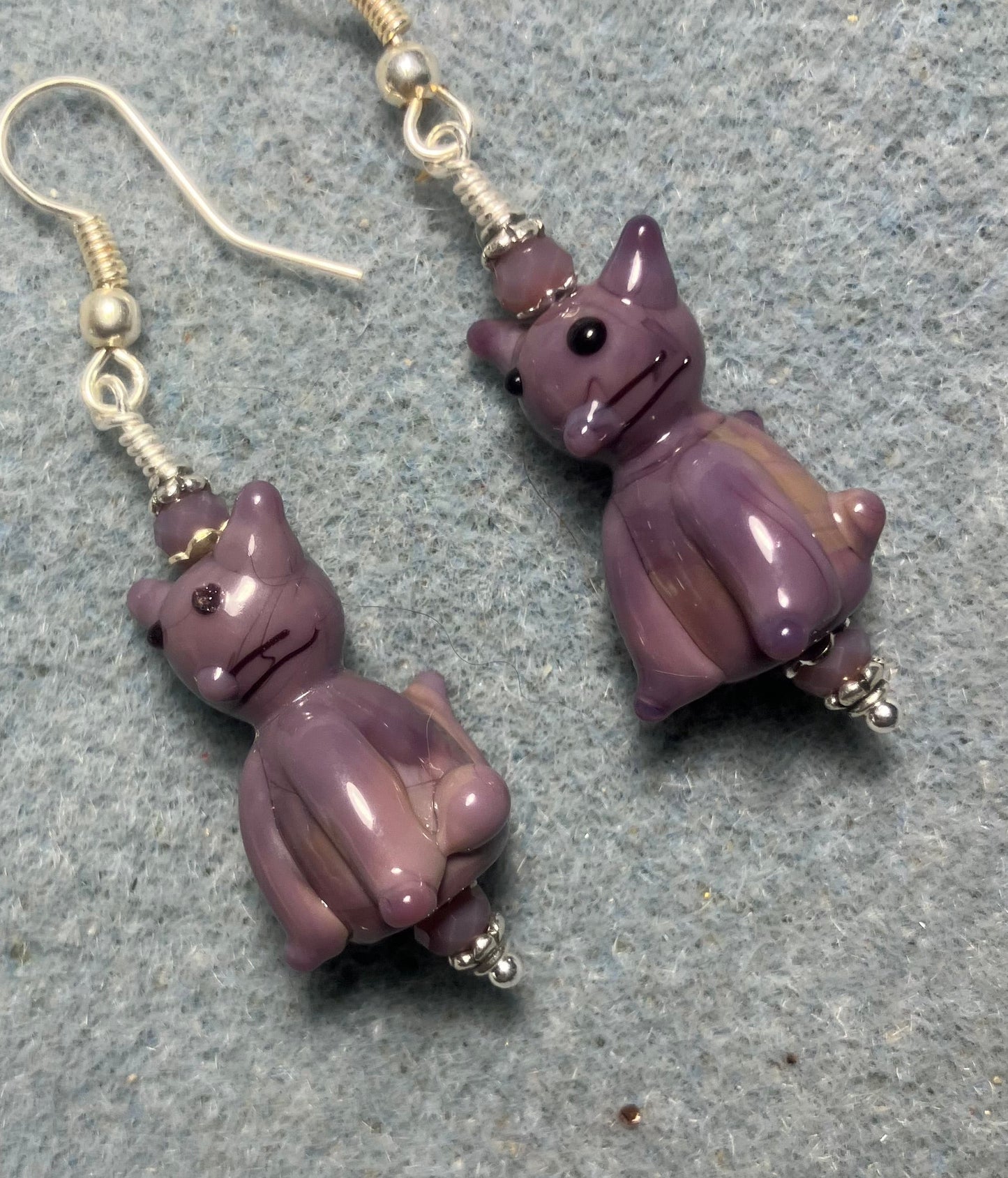 Opaque violet lamp cat bead earrings adorned with violet Chinese crystal beads.
