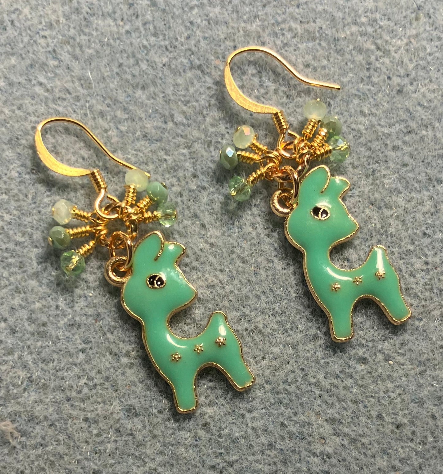 Green enamel deer charm earrings adorned with tiny dangling green Chinese crystal beads.