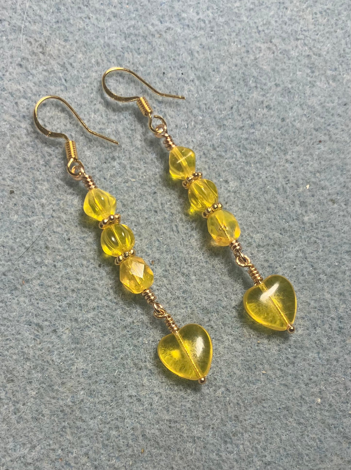 Small lemon yellow Czech glass heart bead earrings adorned with lemon yellow Czech glass beads.