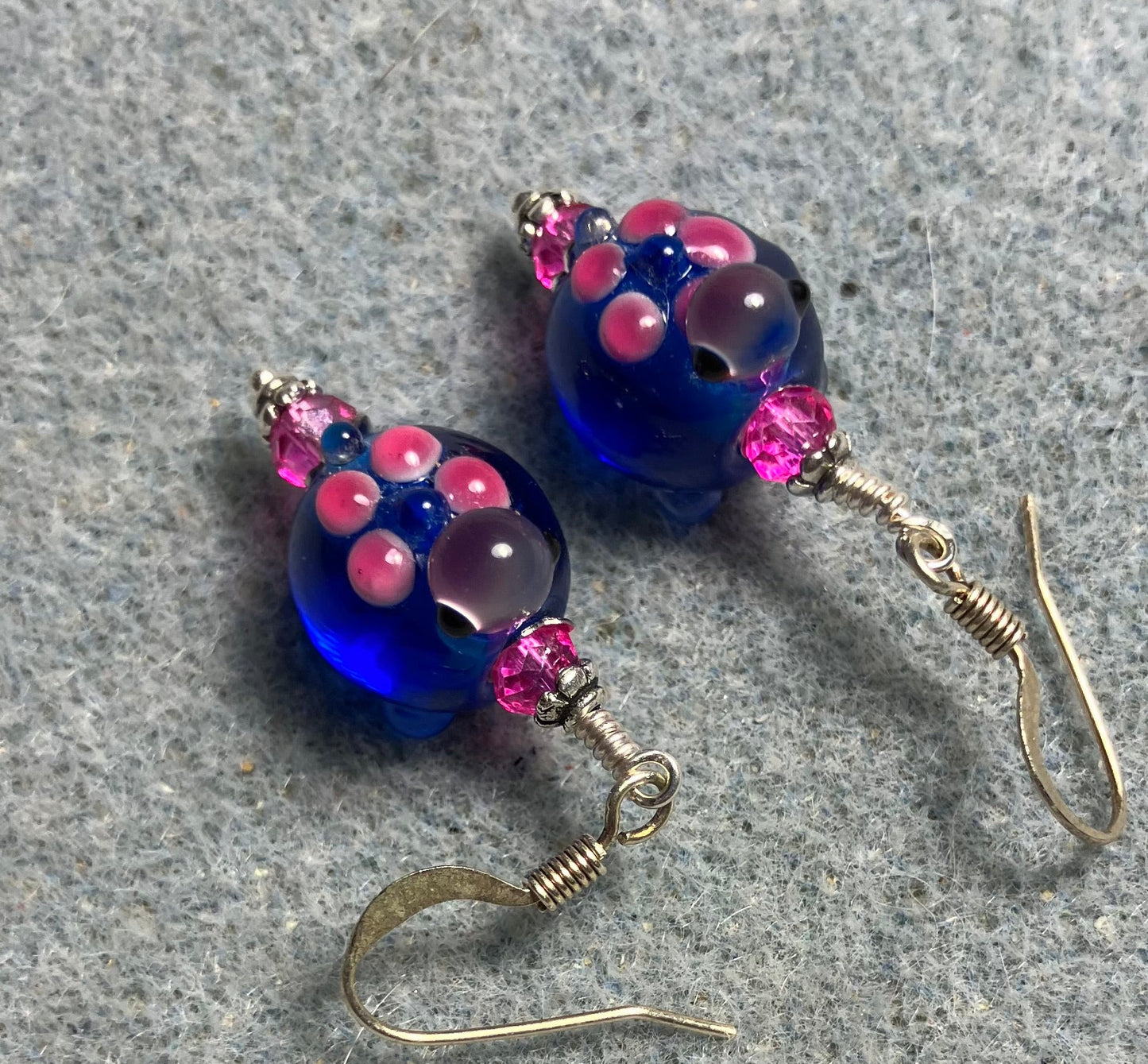 Bright blue and hot pink lamp work turtle bead earrings adorned with hot pink Chinese crystal beads.