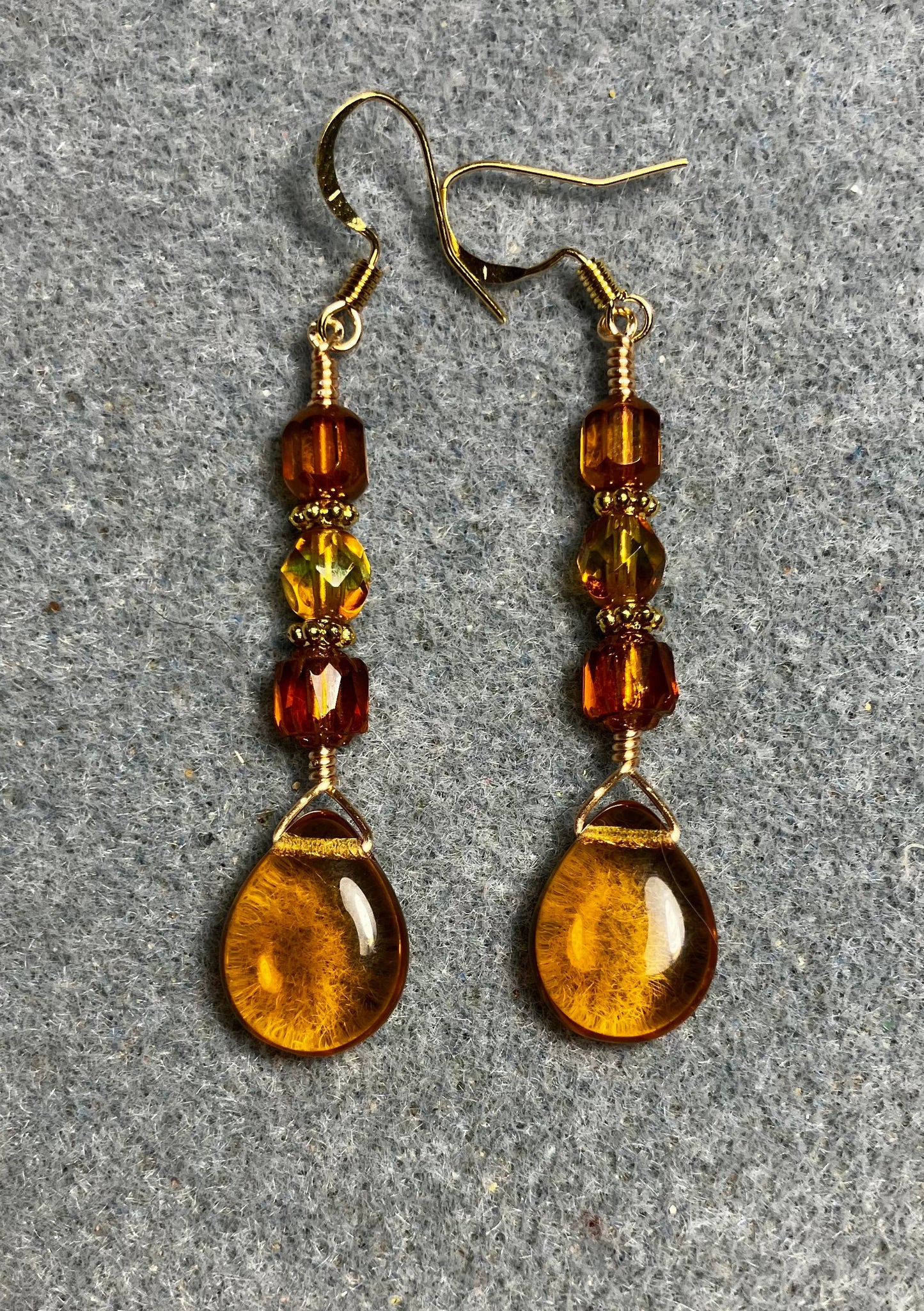 Amber Czech glass pear drop bead earrings adorned with  amber Czech glass beads.