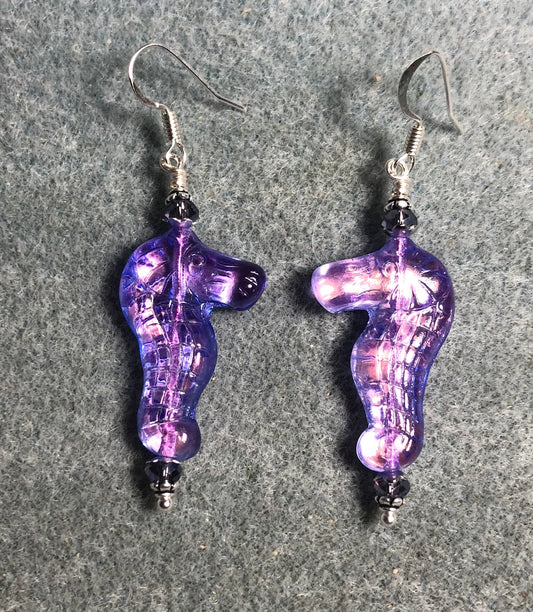 Shimmery violet Czech glass seahorse bead earrings adorned with violet Chinese crystal beads.