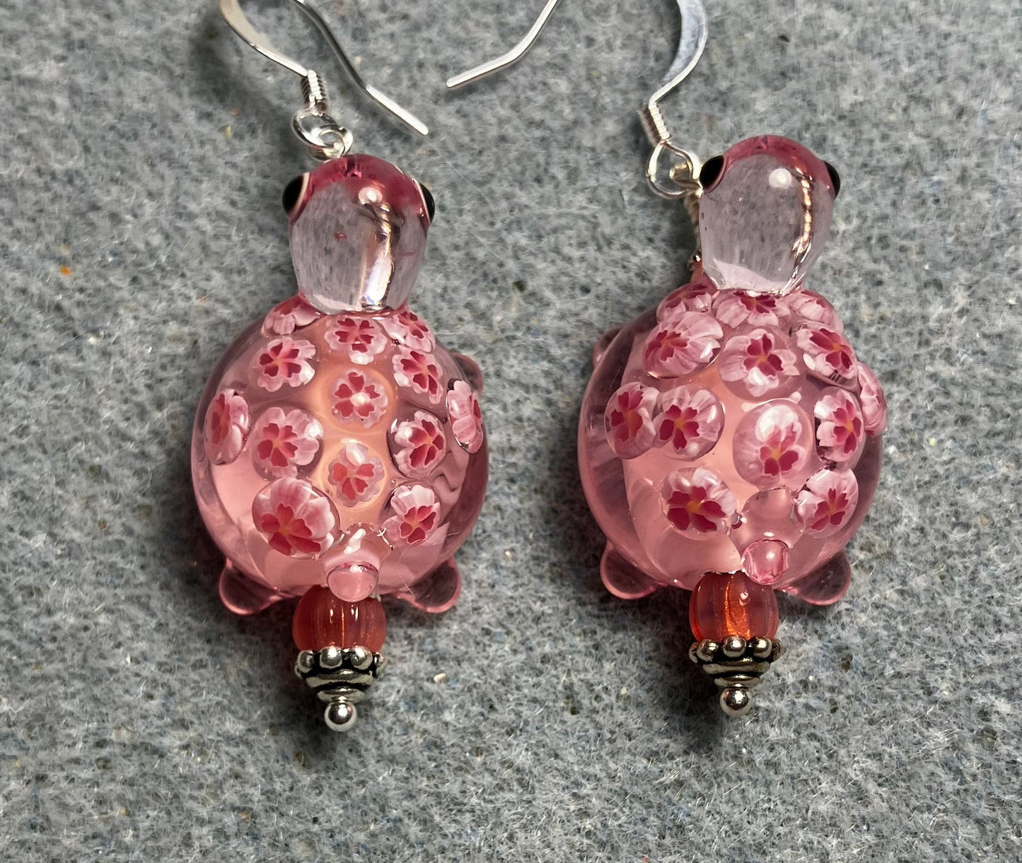 Large pink lamp work turtle bead earrings adorned with pink Czech glass beads.