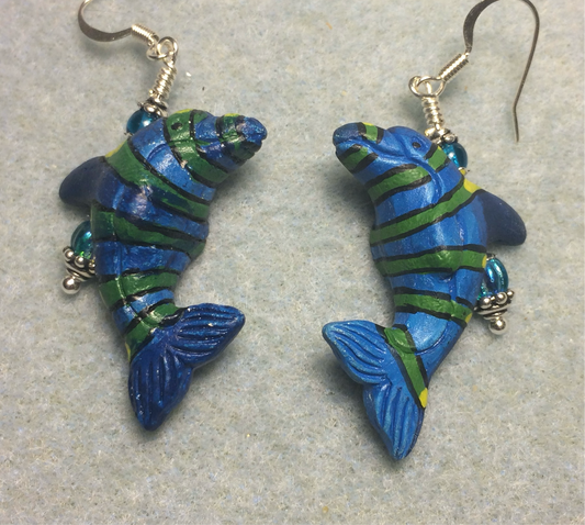 Turquoise blue and green ceramic striped dolphin bead earrings adorned with turquoise Czech glass beads.