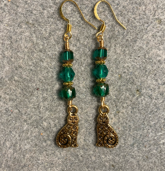 Gold swirly tail cat charm earrings adorned with teal Czech glass beads