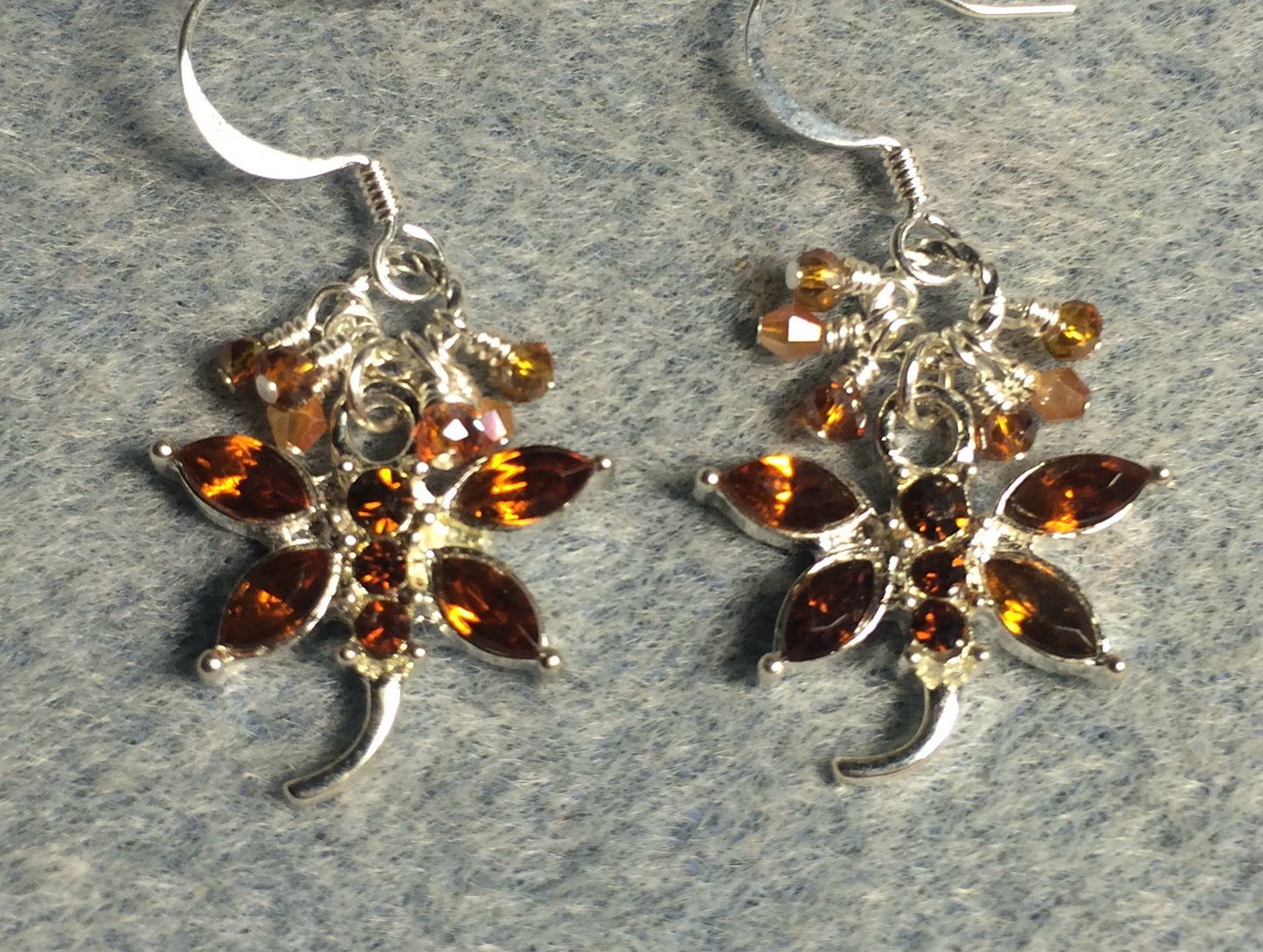 Topaz and silver rhinestone dragonfly charm earrings adorned with tiny dangling topaz and amber Chinese crystal beads.