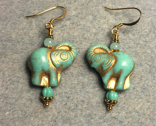 Light turquoise (with gold inlay) Czech glass elephant bead earrings adorned with light turquoise Czech glass beads.