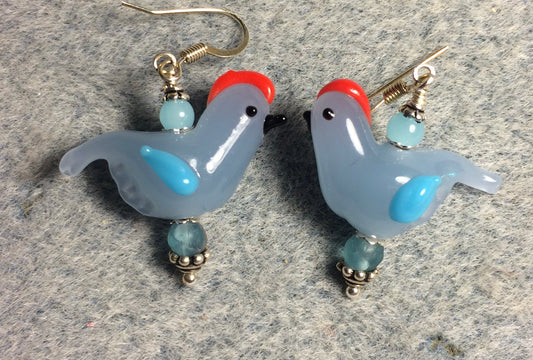 Opaque light blue and aqua lamp work songbird bead earrings adorned with aqua Czech glass beads.