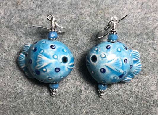 Light blue ceramic blowfish bead earrings adorned with light blue Chinese crystal beads.