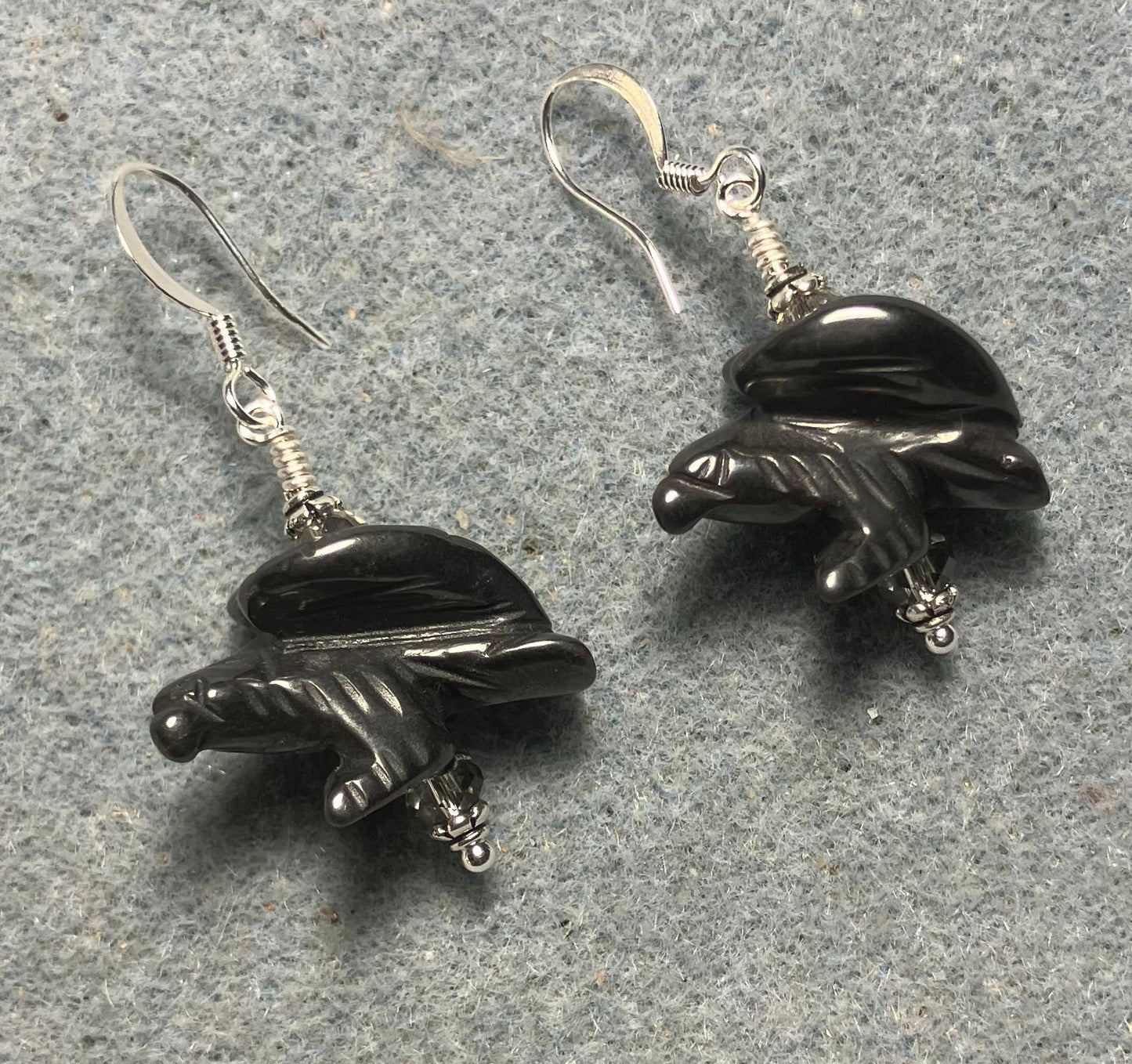 Large gray hematite gemstone flying eagle bead earrings adorned with gray Chinese crystal beads.