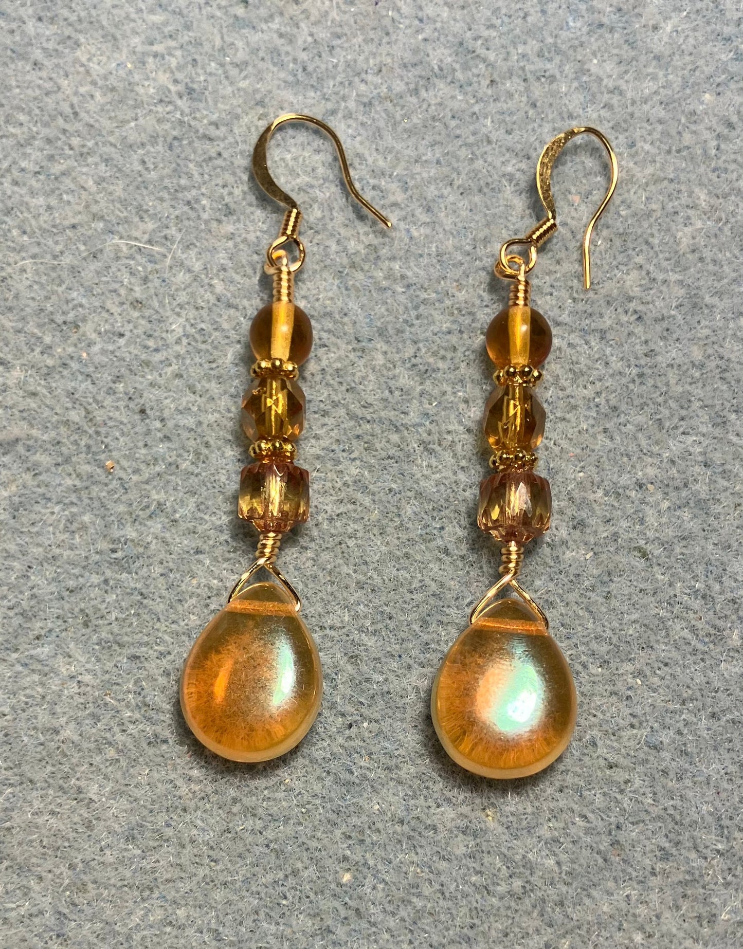 Amber Czech glass pear drop bead earrings adorned with amber Czech glass beads.