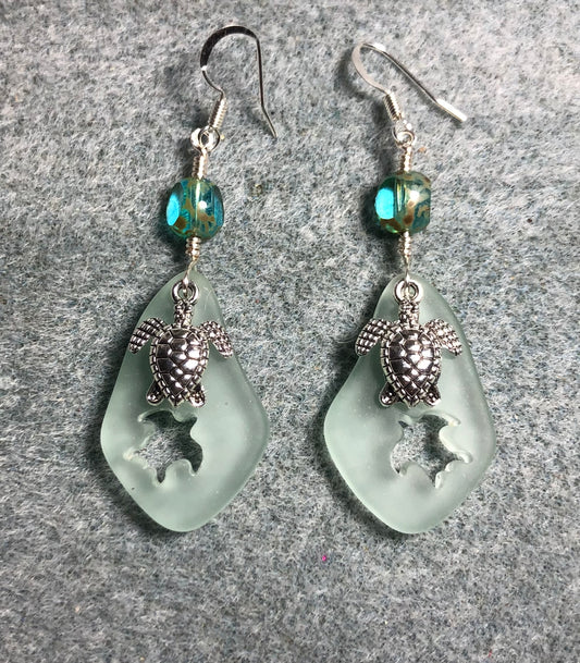 Light green sea glass sea turtle pendant bead earrings adorned with silver sea turtle charms and light green turquoise Czech glass beads.