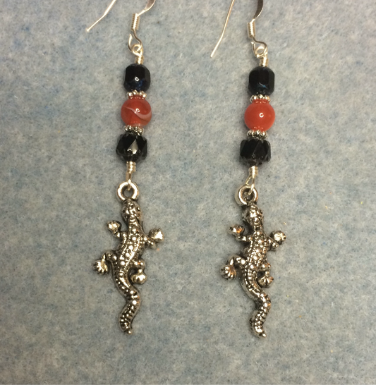 Silver lizard charm earrings adorned with black and orange Czech glass beads