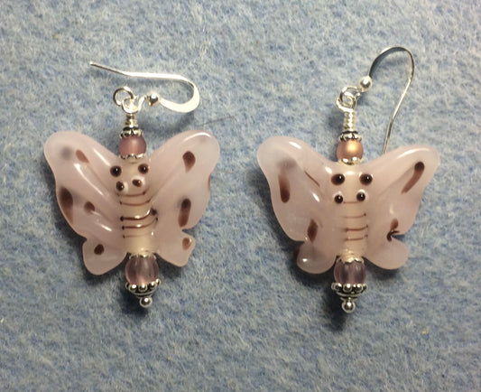 Opaque light pink lamp work butterfly bead earrings adorned with light pink Czech glass beads.