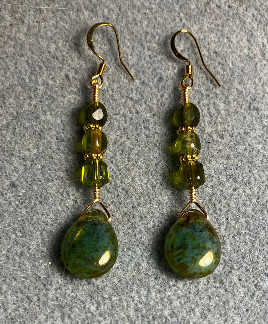 Olive green Czech glass pear drop bead earrings adorned with olive green Czech glass beads.