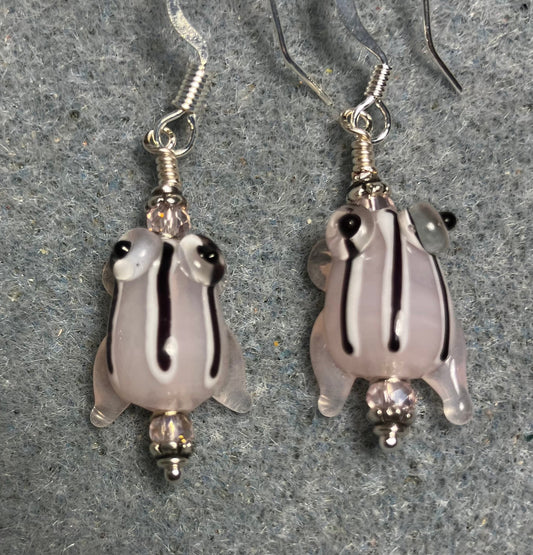Very small translucent pink with black stripes lamp work frog bead earrings adorned with light pink Chinese crystal beads.