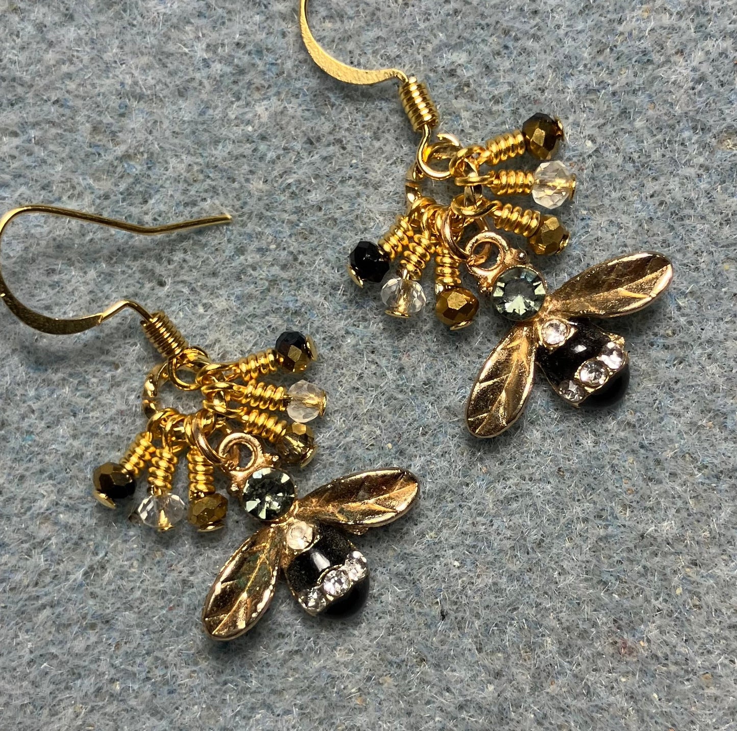 Gold and black enamel and rhinestone honeybee charm earrings adorned with tiny dangling black, gold, and clear Chinese crystal beads.