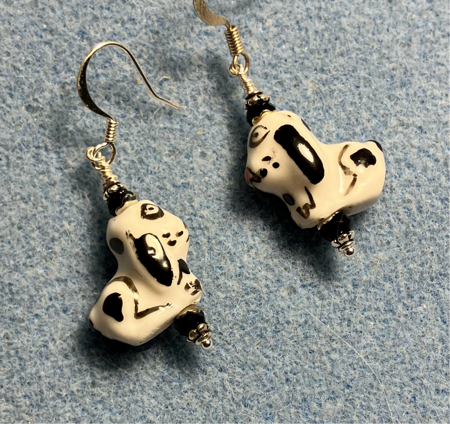 Black and white ceramic puppy dog bead earrings adorned with black Chinese crystal beads.